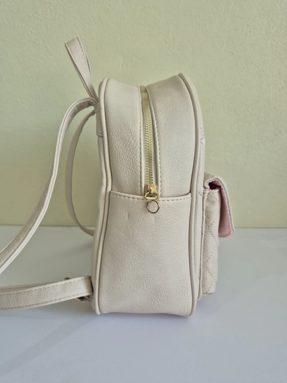 Under One Sky Cream Quilted Backpack with Gold Heart Lock